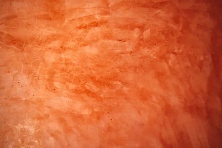 Smooth warm red-orange trowelled surface