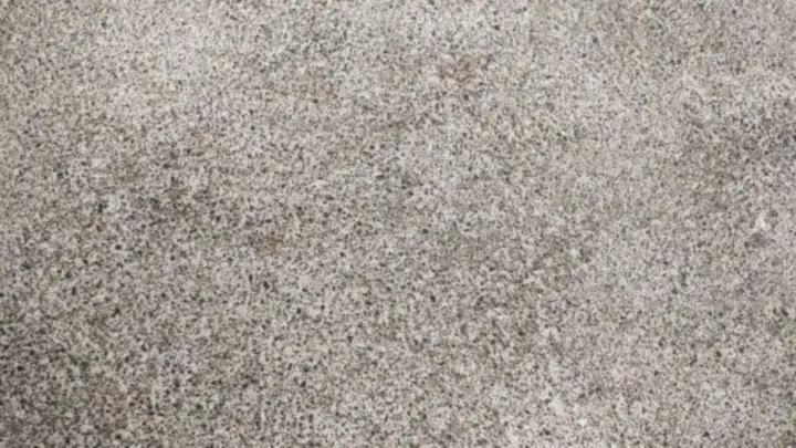 Fine speckled grey concrete surface with small aggregate just showing