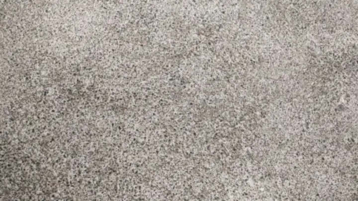Fine speckled grey concrete surface with small aggregate just showing