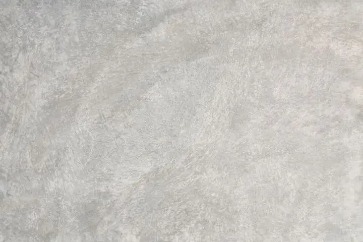 Smooth pale grey trowelled concrete with faint swirl marks