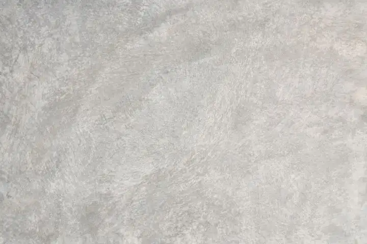 Smooth pale grey trowelled concrete with faint swirl marks